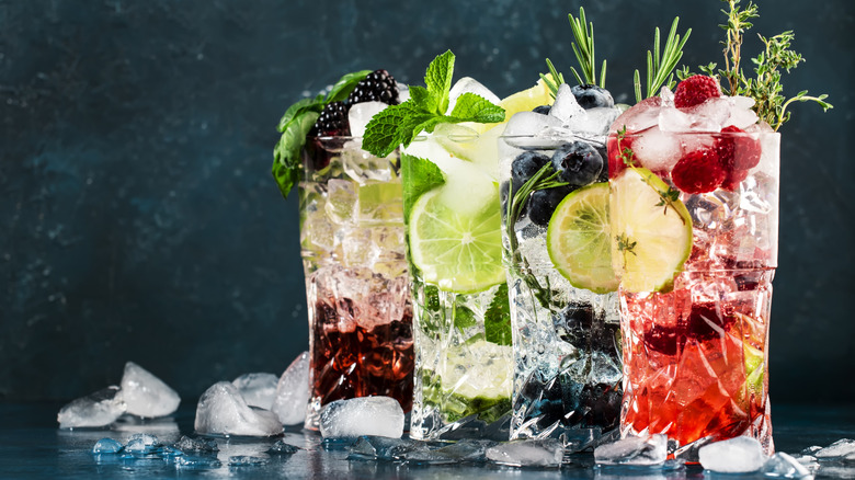 Assorted fruity mocktails surrounded by ice