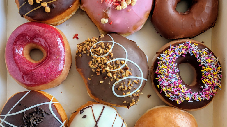 A variety of donuts in a bakery box