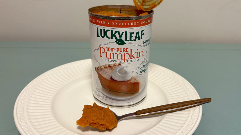 An open can of Lucky Leaf pure pumpkin on a plate