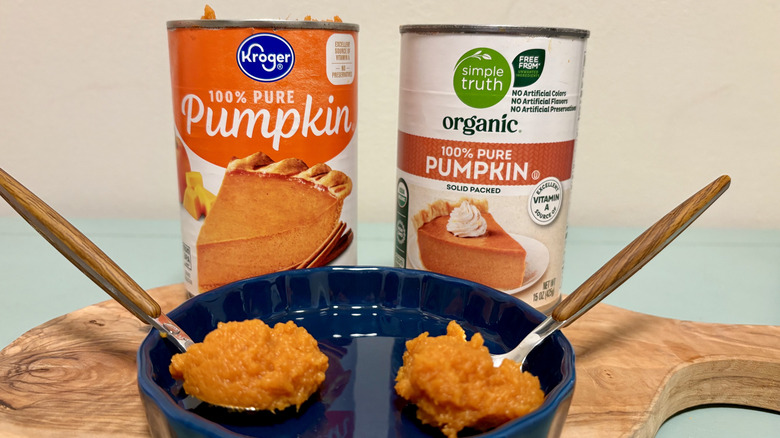 Cans and spoonfuls of Kroger and Simple Truth pumpkin puree