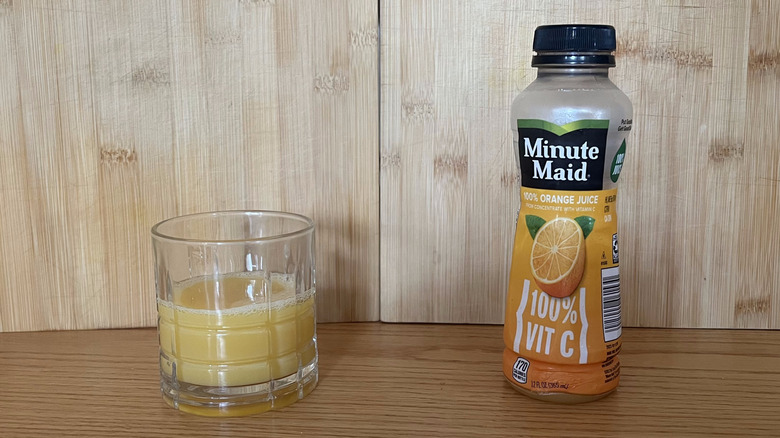 A small bottle of Minute Maid orange juice