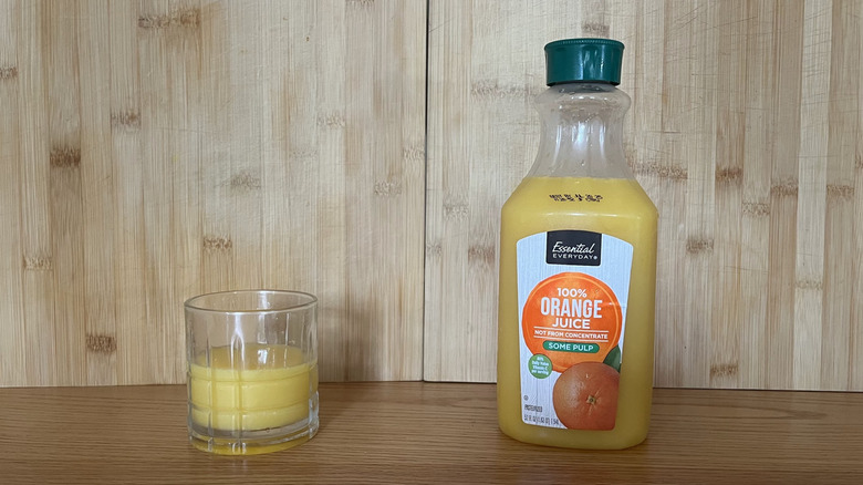A bottle of Everyday Essentials orange juice