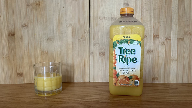 A bottle of Tree Ripe orange juice