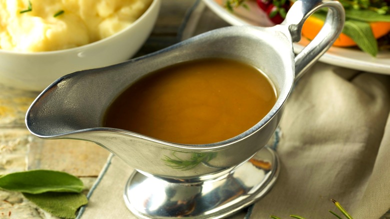 Brown gravy in a white gravy boat