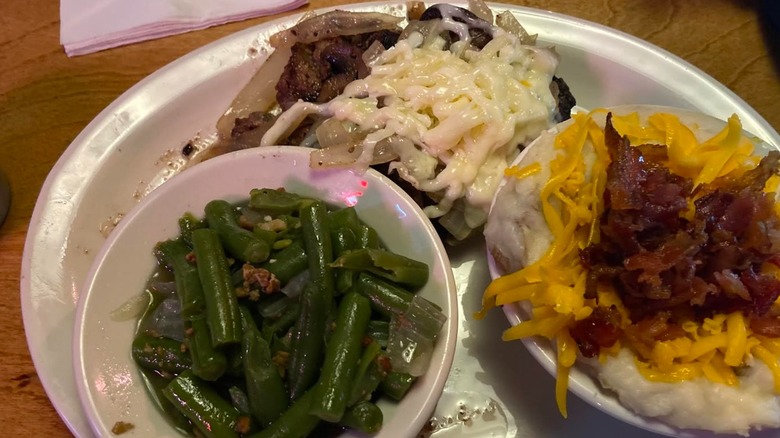 Texas Roadhouse Road Kill dinner with a baked potato