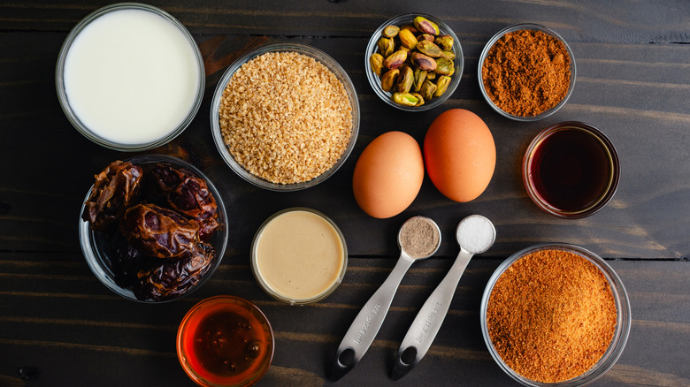Middle Eastern breakfast ingredients laid out on a wooden surface