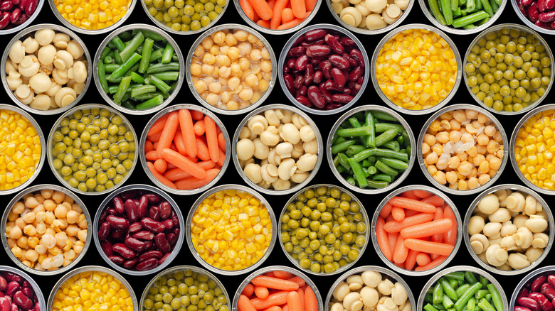 An overhead shot of rows of various canned vegetables
