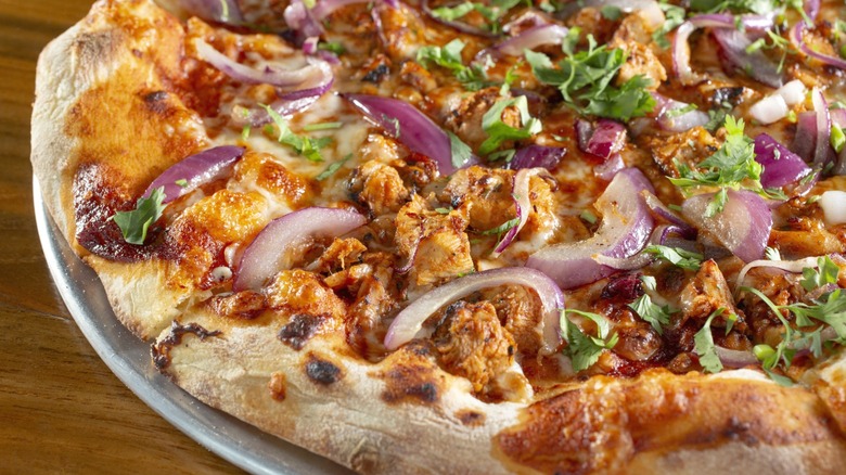 Barbecue chicken pizza with red onions and cilantro