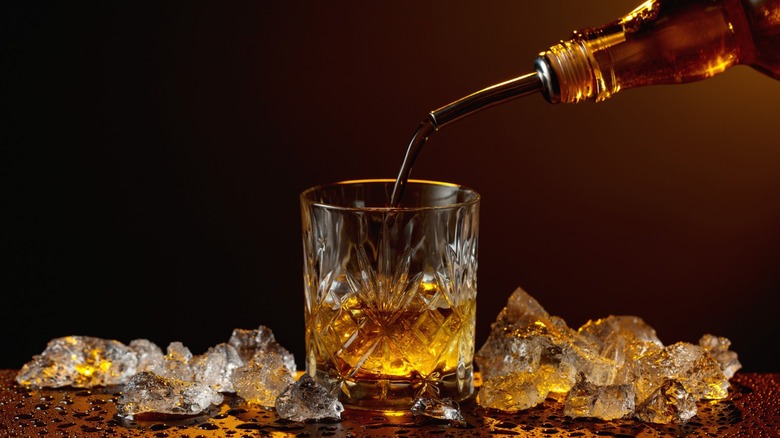 Whiskey being poured into a glass