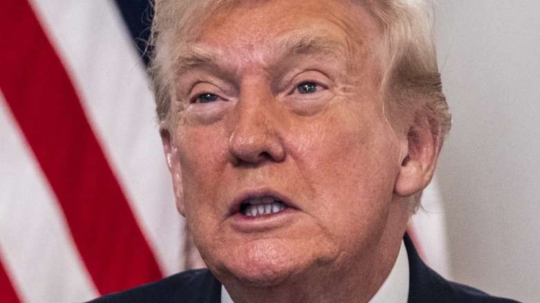 Donald Trump in front of an American flag