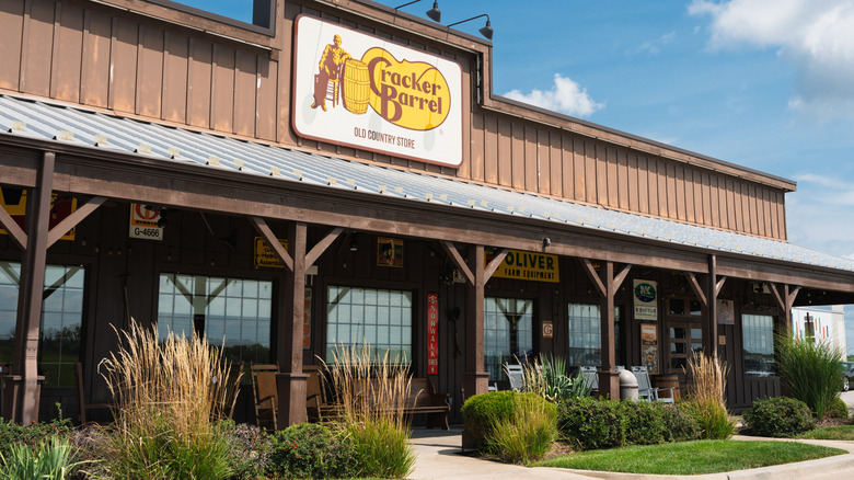 Sun shines on the front porch of a Cracker Barrel restaurant.
