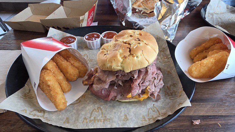 Half Pound Beef 'n Cheddar on tray with hash browns
