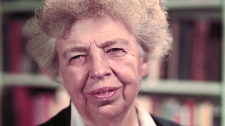 Eleanor Roosevelt in front of a bookcase