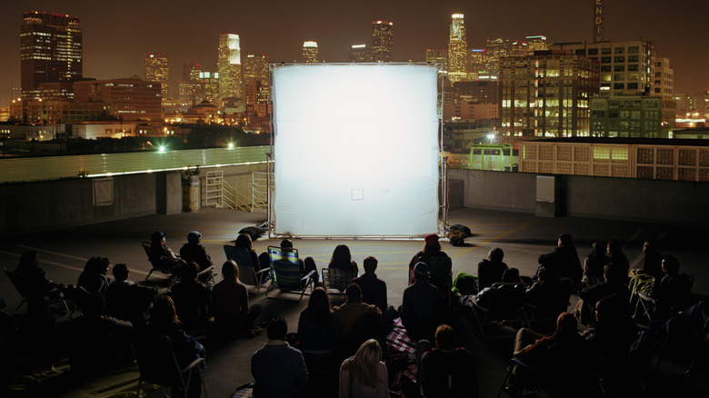 People watching movie on a rooftop