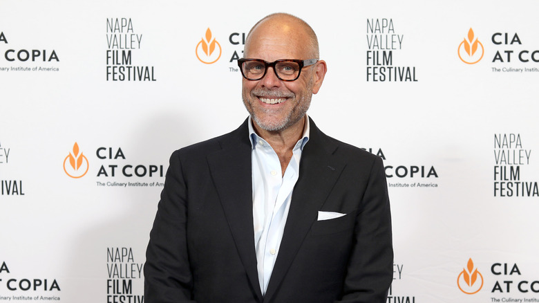 Alton Brown smiling on the red carpet for the Napa Valley Film Festival