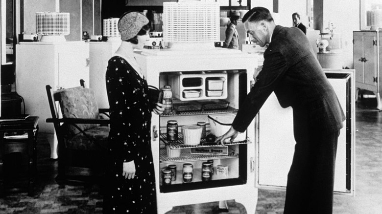 A refrigerator salesman and potential client circa 1920s or '30s