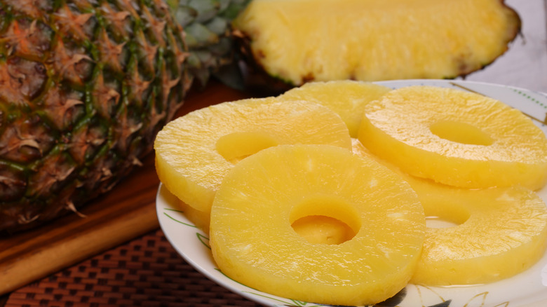 Sliced pineapple rings on a plate