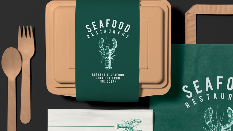 Seafood restaurant branding on takeaway containers