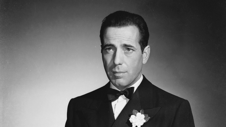 American actor Humphrey Bogart wearing a tuxedo and bow tie.