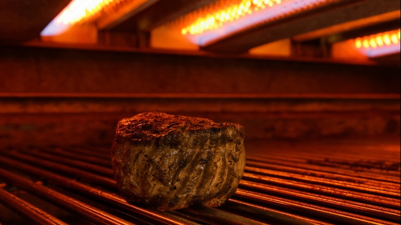 Tenderloin steak under hot broiler.