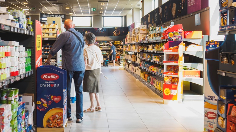 Aldi shoppers in an aisle.