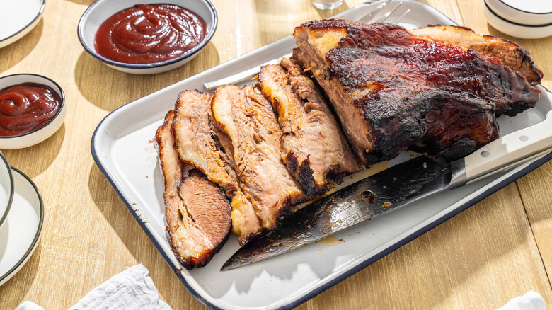 Texas barbecue brisket served with bbq sauce on the side.