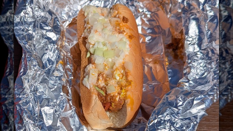A West Virginia hot dog with chili, coleslaw, mustard, and onions