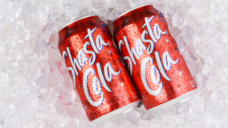 cans of Shasta Cola on ice