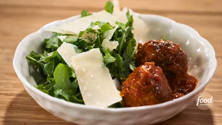 Meatball salad in a white bowl