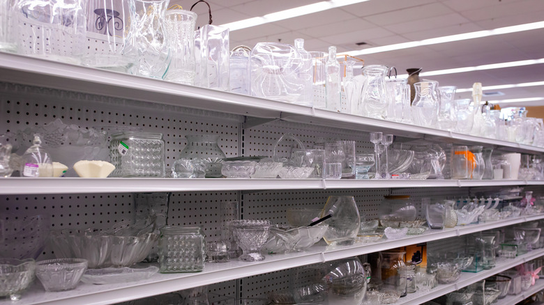 Large aisle of glassware at thrift store