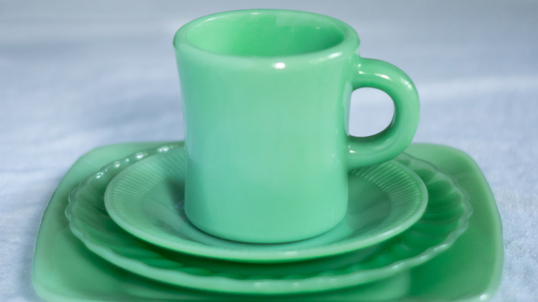 Fire-King Jadeite cup and dishes stacked on top of each other