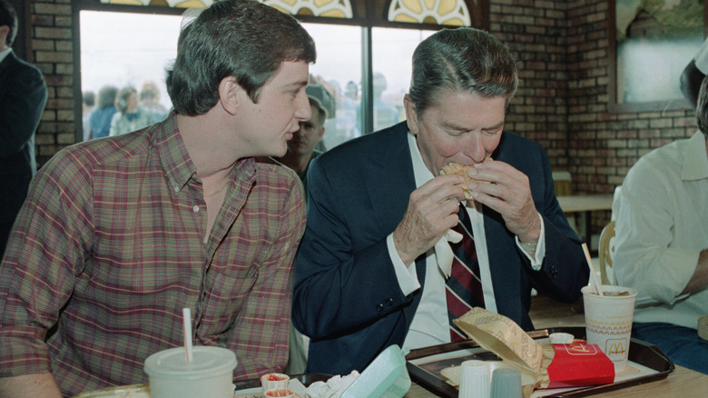 Then-President Ronald Reagan eats a McDonald's burger