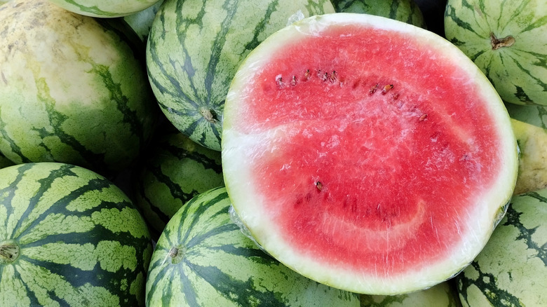 Half watermelon and whole watermelons