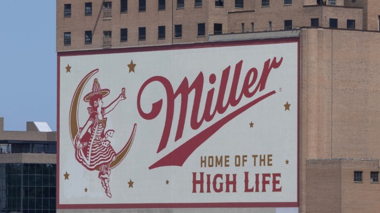 A building-side advertisement for Miller.