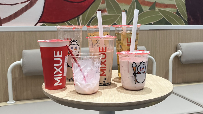 Various drinks gathered on a table at Mixue