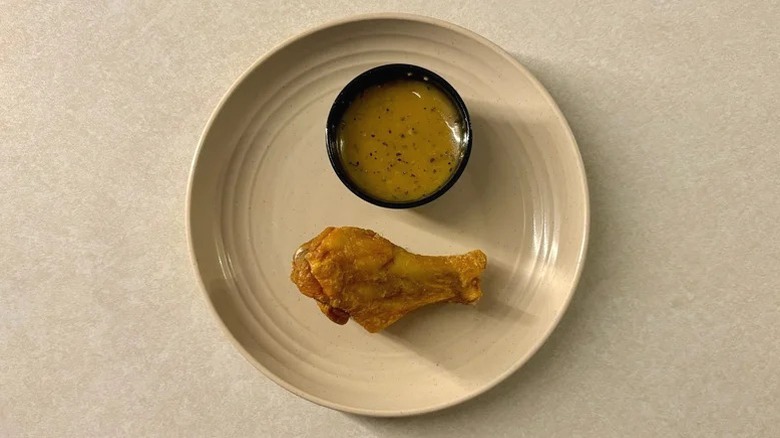 A chicken wing with Buffalo Wild Wings' Lemon Pepper sauce.