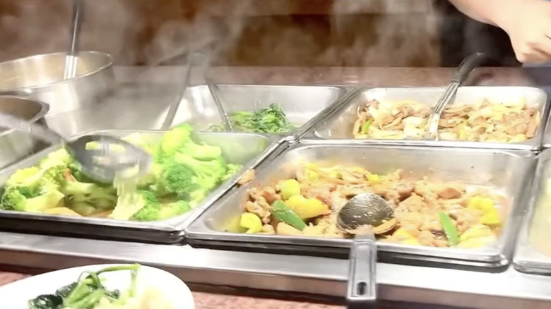 Buffet trays with meats and vegetable dishes at New Tin Tin Buffet