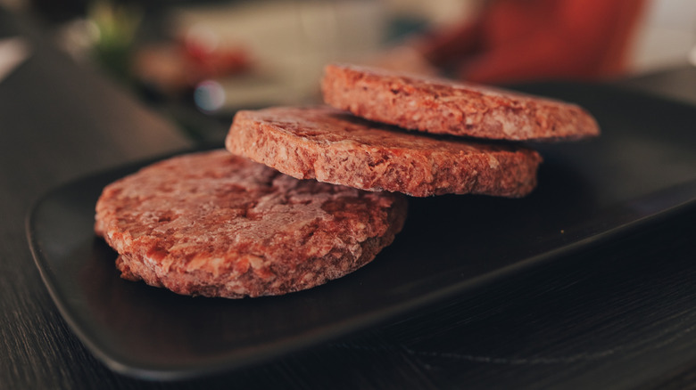 frozen burger patties on platter