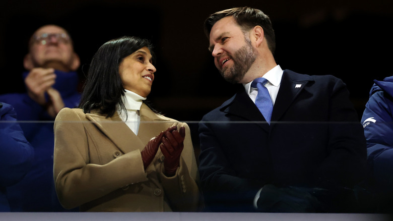 JD Vance and Usha Vance talk amongst applause