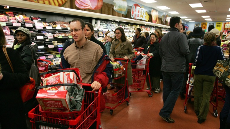 Many shoppers line up and browse groceries inside Trader Joe's