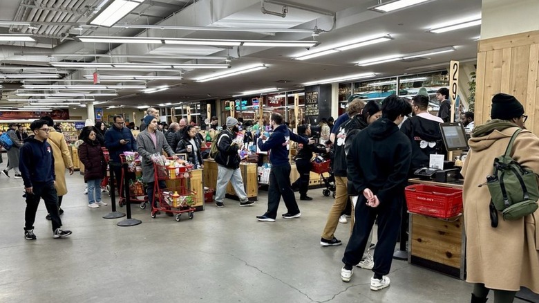 Very crowded interior checkout line at Trader Joe's in Downtown Brooklyn (City Point), New York