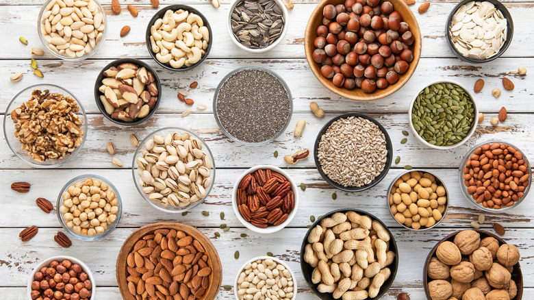 Assorted small bowls of nuts and seeds