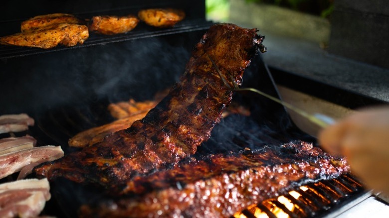 Ribs and chicken on a gas grill.