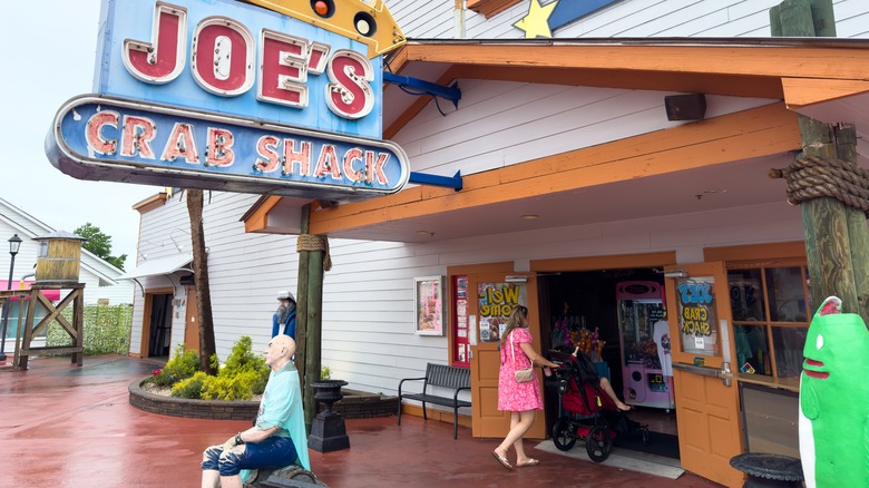 Diners walking into a Joe's Crab Shack restaurant