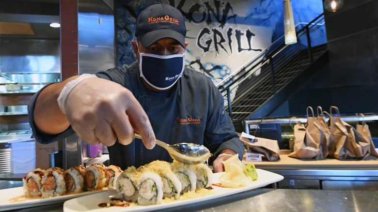 A Kona Grill chef preparing a sushi plate