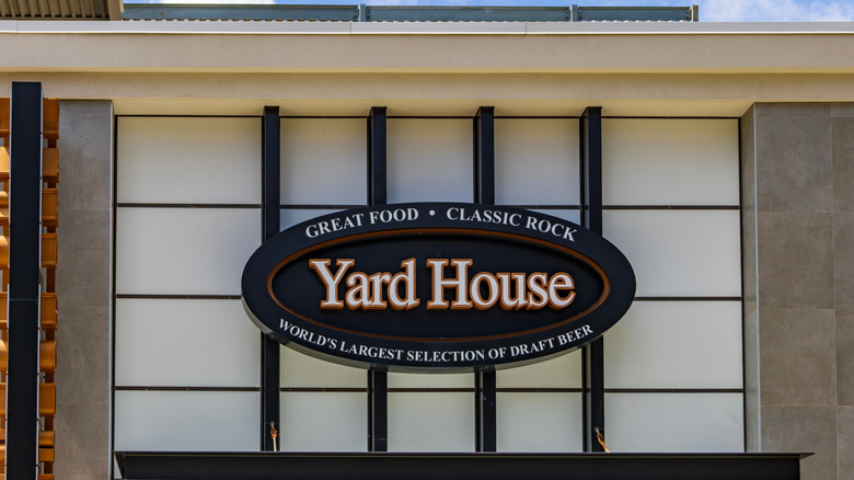 Yard House restaurant sign positioned on an exterior wall