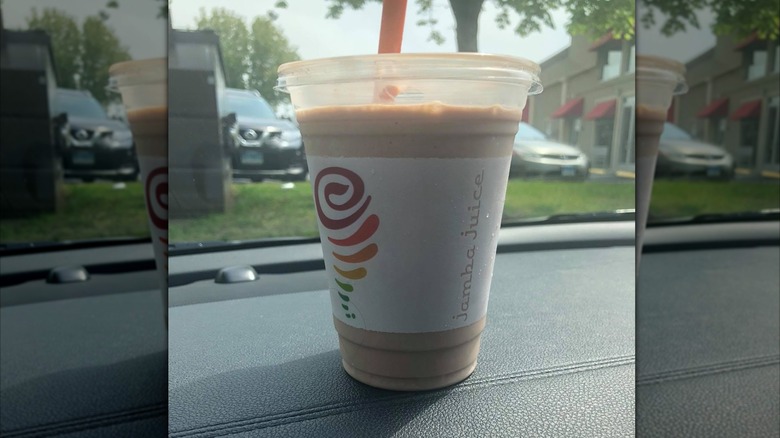 Cup of Jamba Peanut Butter Moo'd on car dash