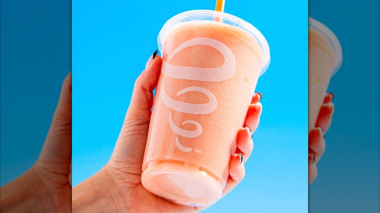 Hand holding White Gummi Smoothie from Jamba