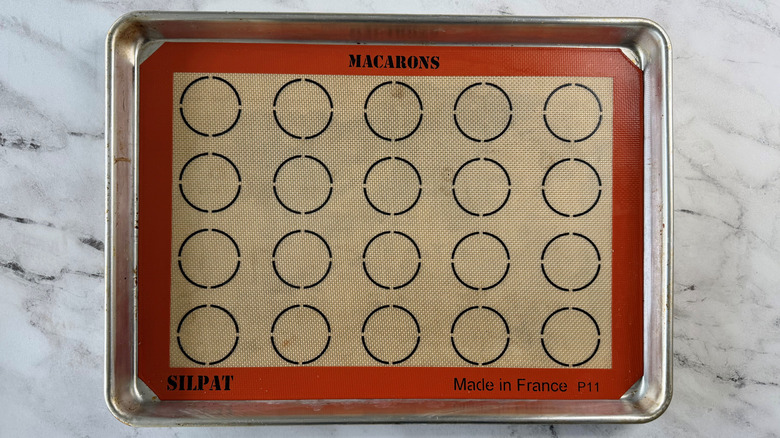 baking pan lined with some type of mat with circular markings