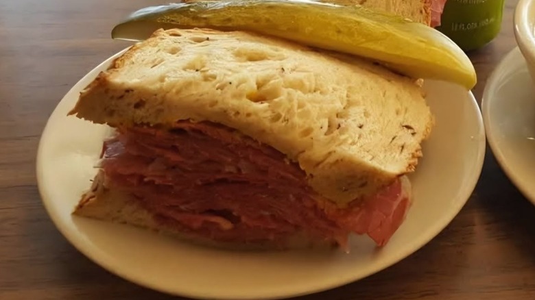 Pastrami sandwich with a pickle on the side from Shapiro's Delicatessen